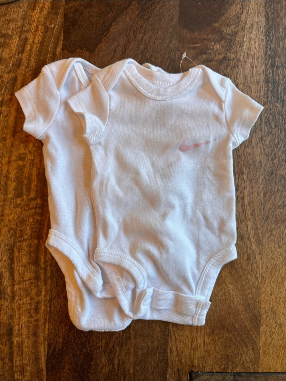 Nike White Baby Onesies with Light Pink Swoosh - 2 Pack
